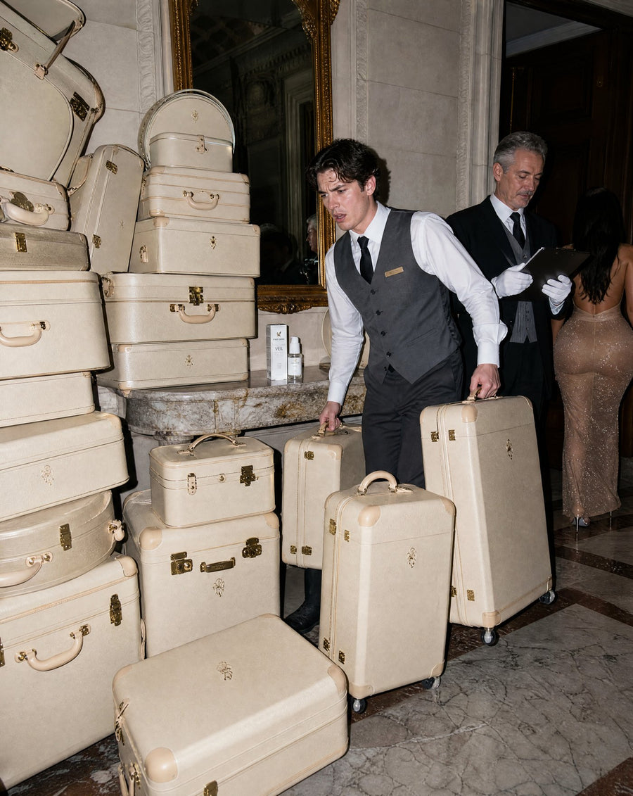 An arrival, fourteen suitcases